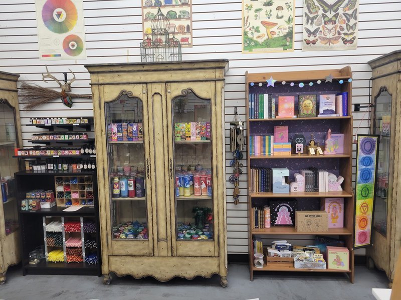 Shelving display featuring amethyst, quartz, and various crystal specimens