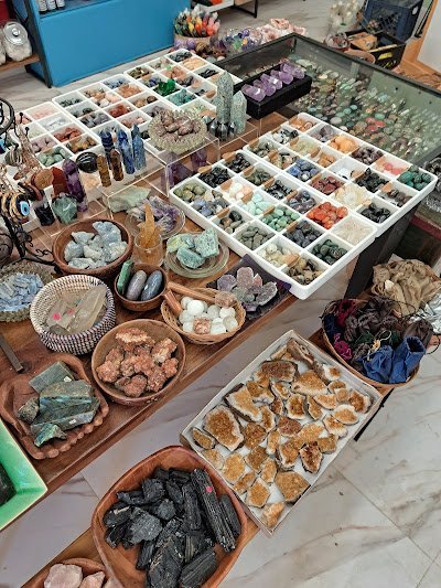 Selection of healing crystals, tumbled stones, and decorative mineral pieces