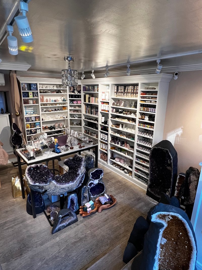 Collection of tumbled stones, raw minerals, and crystal clusters