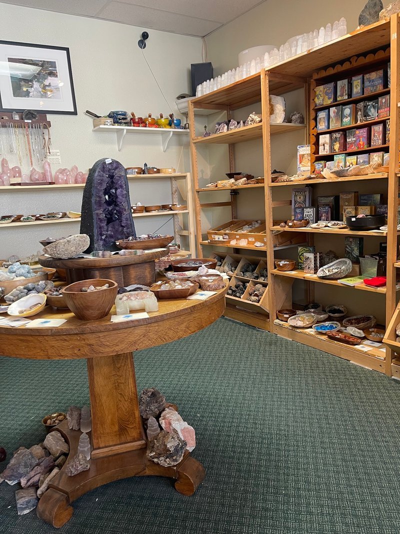 Organized crystal display with labeled stones and healing minerals