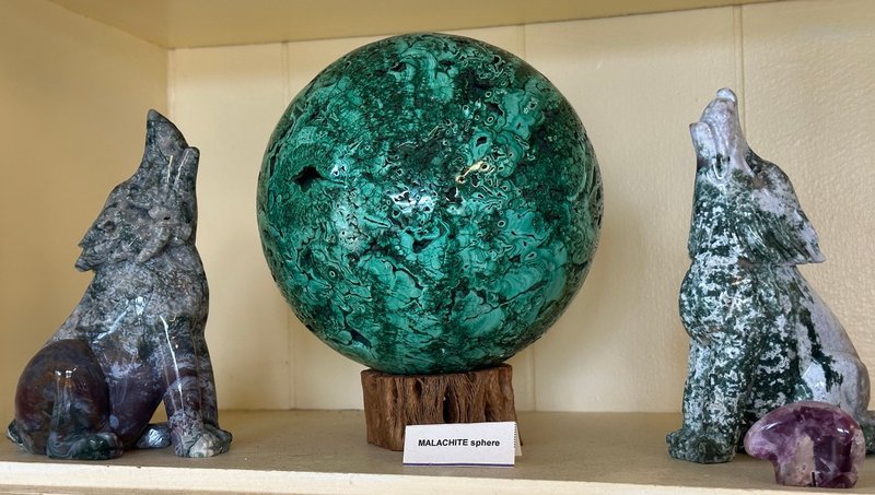 Retail display with tumbled stones, raw crystals, and polished specimens