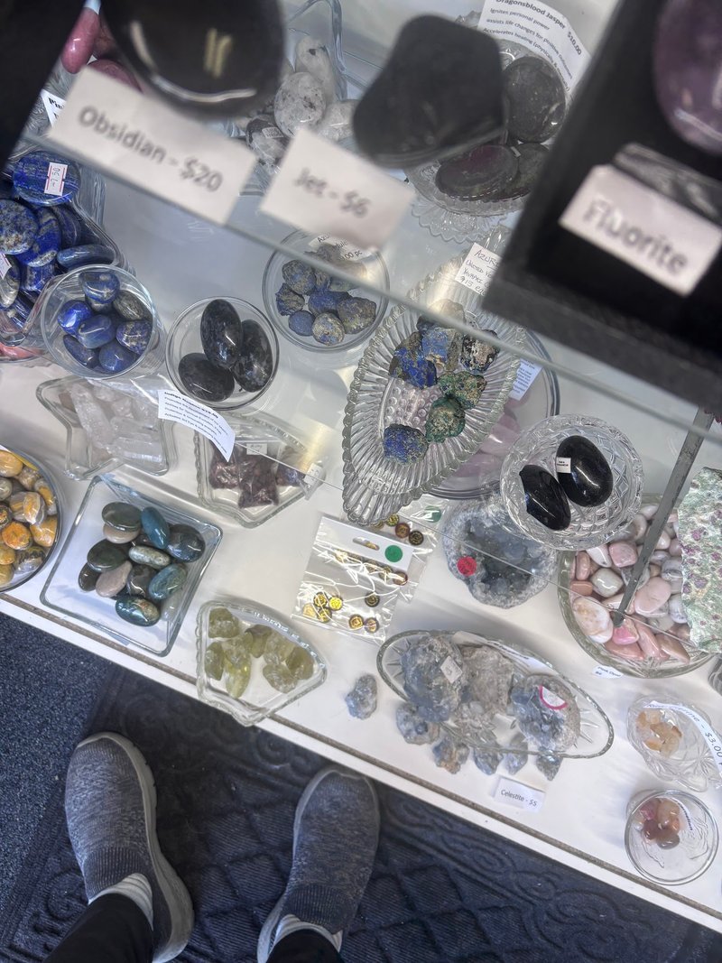 Crystal and mineral specimens including quartz, amethyst, and calcite varieties