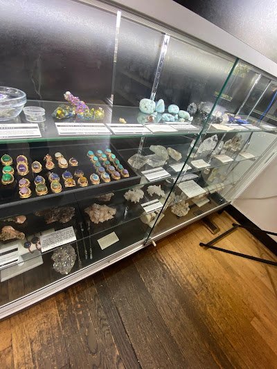 Shop interior featuring gemstones, healing crystals, and spiritual products