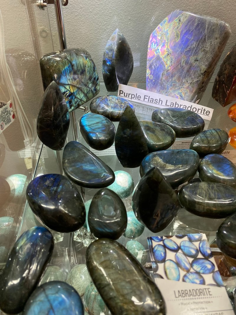 Shop interior featuring gemstones, healing crystals, and spiritual products