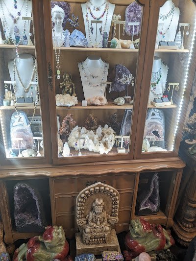 Selection of healing crystals, tumbled stones, and decorative mineral pieces