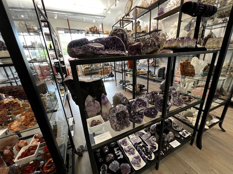 Retail display with tumbled stones, raw crystals, and polished specimens