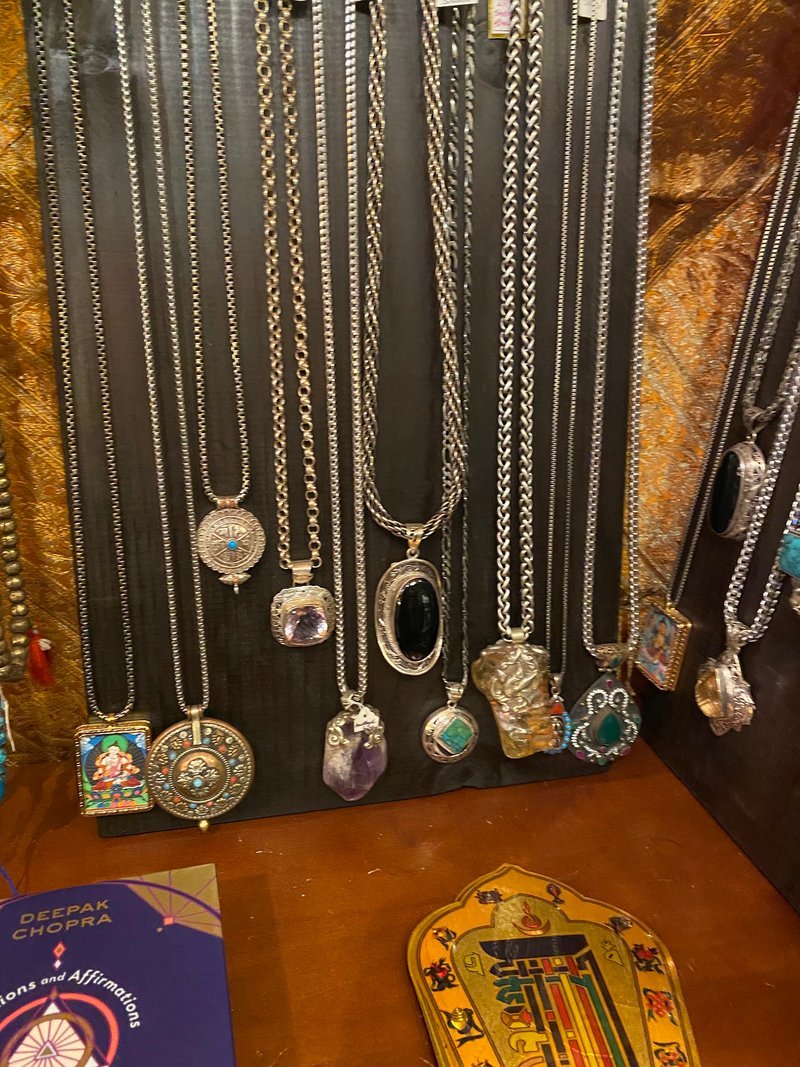 Variety of gemstones, crystal carvings, and polished mineral specimens