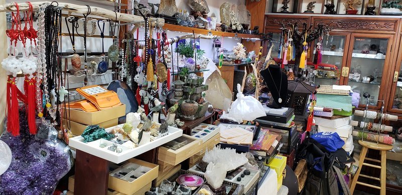 Retail display with tumbled stones, raw crystals, and polished specimens