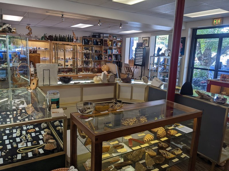Organized crystal display with labeled stones and healing minerals