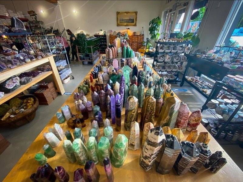 Display of polished crystal specimens, geodes, and mineral towers