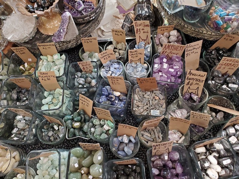 Selection of healing crystals, tumbled stones, and decorative mineral pieces