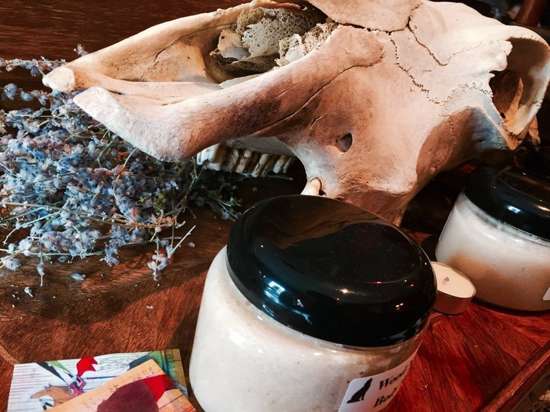 Retail shelving with organized crystals, stones, and spiritual products