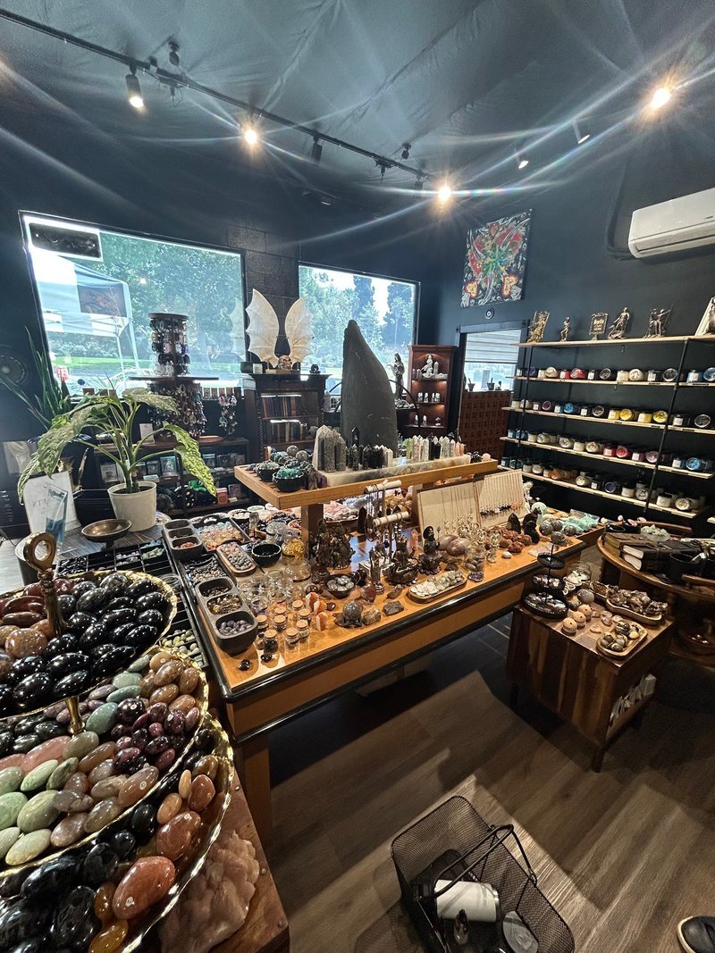 Selection of healing crystals, tumbled stones, and decorative mineral pieces