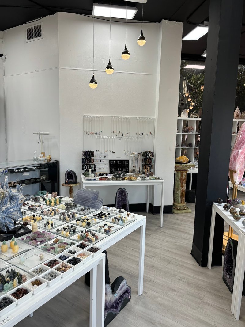Display of polished crystal specimens, geodes, and mineral towers