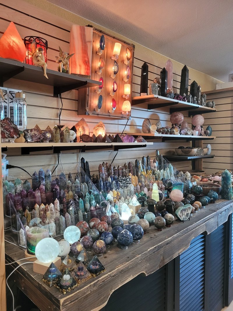 Selection of healing crystals, tumbled stones, and decorative mineral pieces