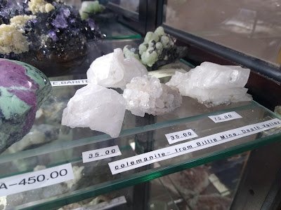 Retail shelving with organized crystals, stones, and spiritual products