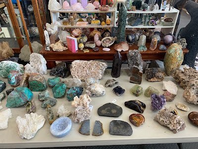 Display of polished crystal specimens, geodes, and mineral towers