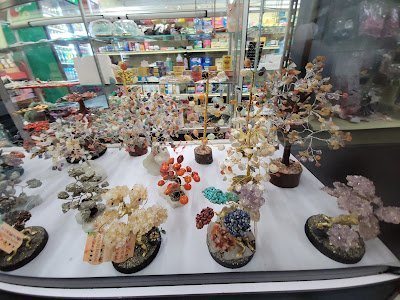 Collection of tumbled stones, raw minerals, and crystal clusters