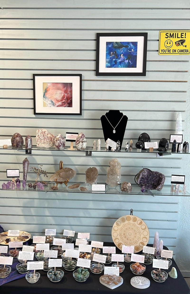 Collection of tumbled stones, raw minerals, and crystal clusters