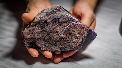 Selection of healing crystals, tumbled stones, and decorative mineral pieces