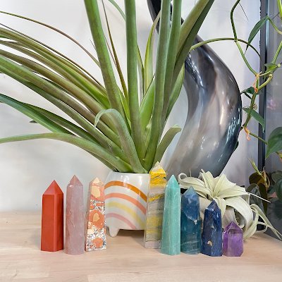 Display of polished crystal specimens, geodes, and mineral towers