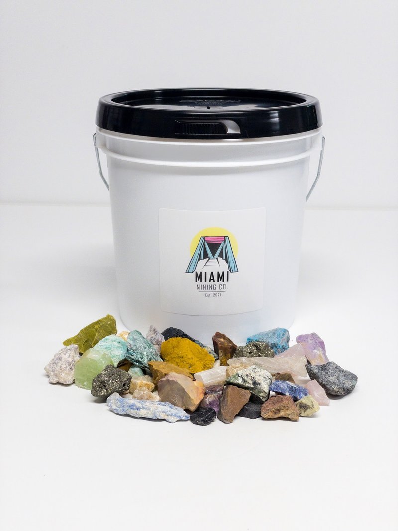 Display featuring crystal points, polished stones, and raw mineral specimens