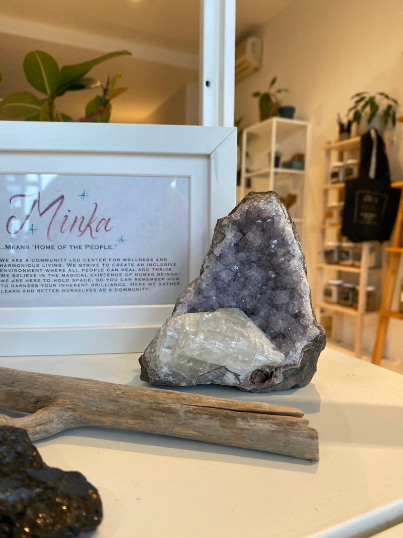 Variety of gemstones, crystal carvings, and polished mineral specimens