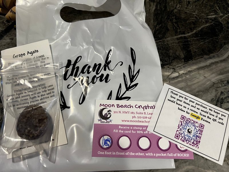 Organized crystal display with labeled stones and healing minerals