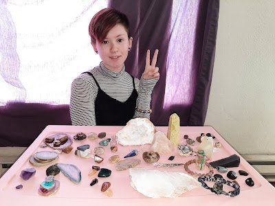 Variety of gemstones, crystal carvings, and polished mineral specimens