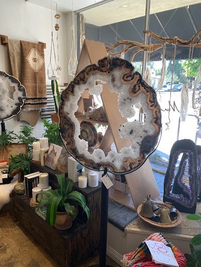 Selection of healing crystals, tumbled stones, and decorative mineral pieces