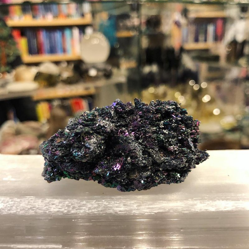 Selection of healing crystals, tumbled stones, and decorative mineral pieces