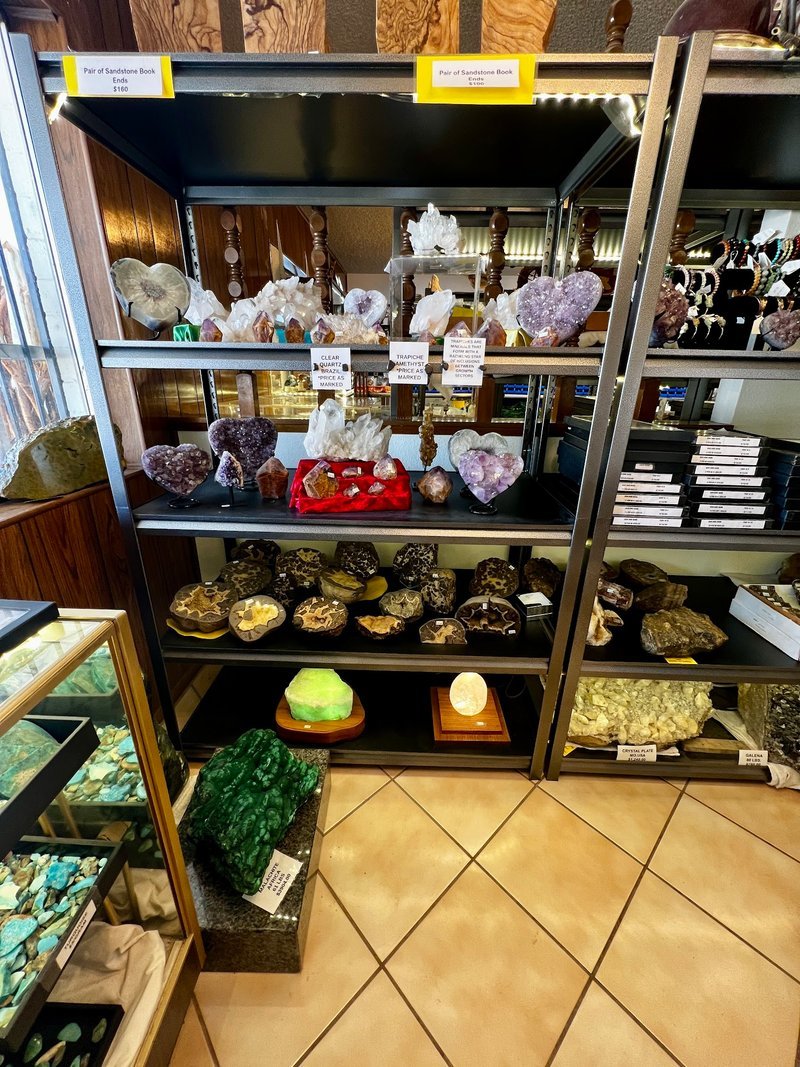 Organized crystal display with labeled stones and healing minerals
