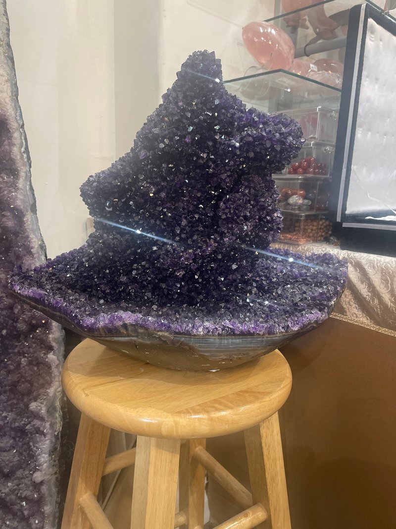 Shop interior featuring gemstones, healing crystals, and spiritual products