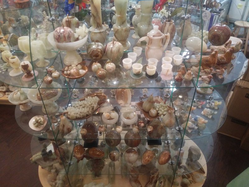 Crystal and mineral specimens including quartz, amethyst, and calcite varieties