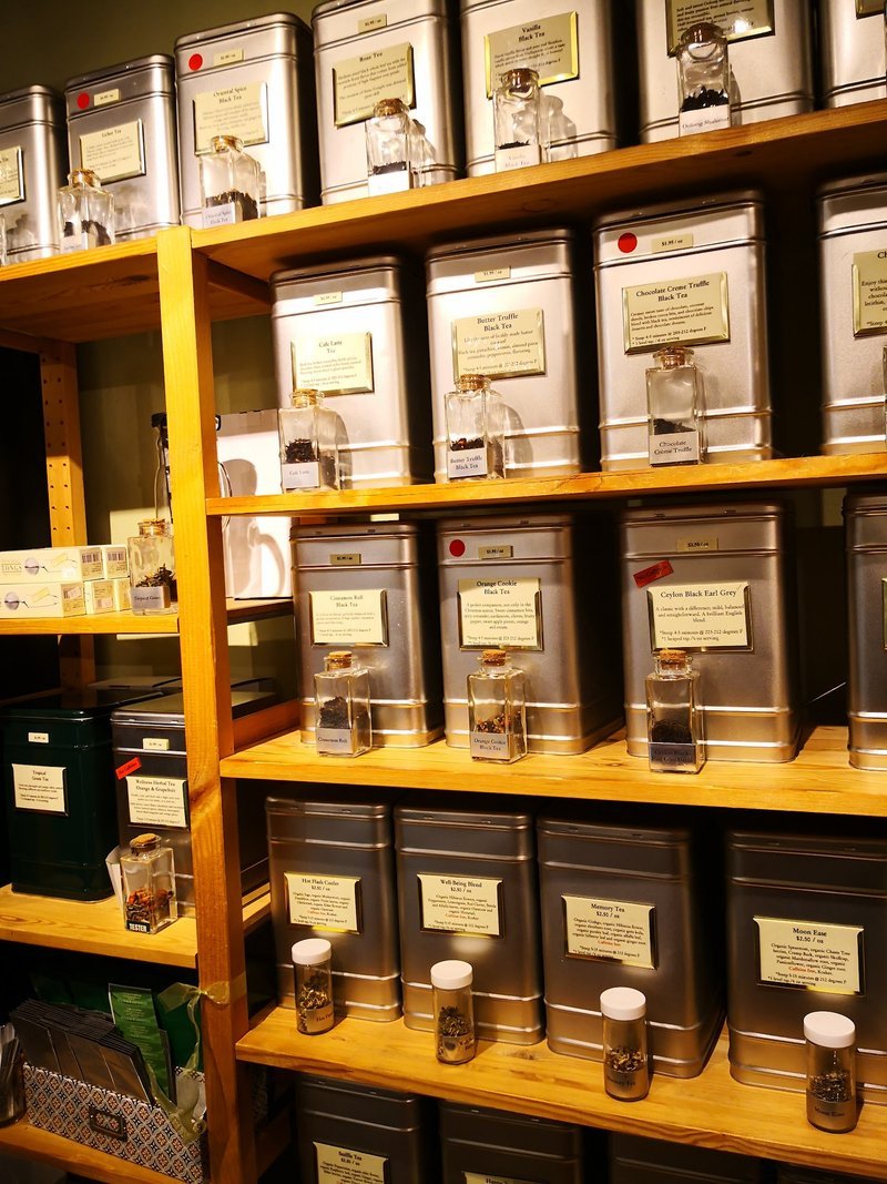 Shelving display featuring amethyst, quartz, and various crystal specimens