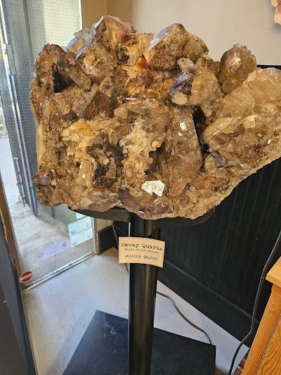 Selection of healing crystals, tumbled stones, and decorative mineral pieces