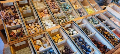 Selection of healing crystals, tumbled stones, and decorative mineral pieces