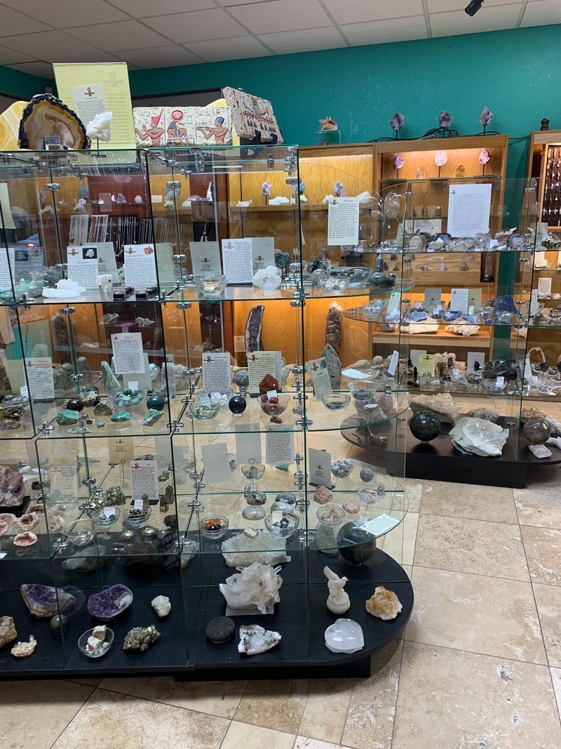 Retail display with tumbled stones, raw crystals, and polished specimens