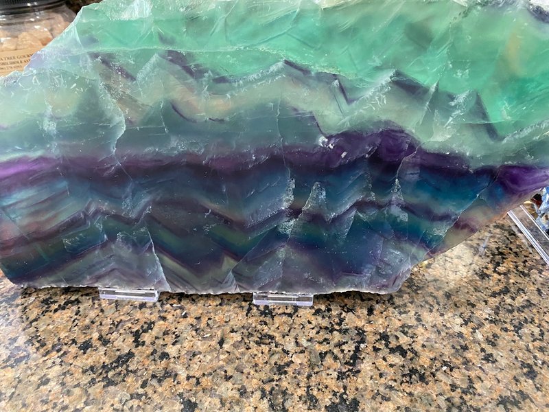 Organized crystal display with labeled stones and healing minerals