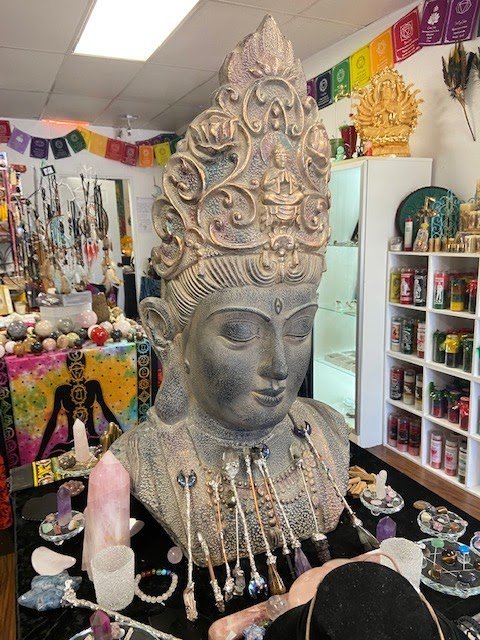 Organized crystal display with labeled stones and healing minerals