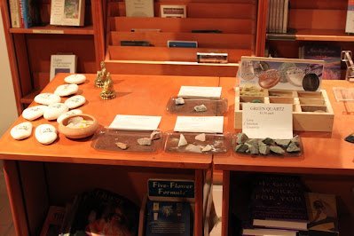 Retail display with tumbled stones, raw crystals, and polished specimens