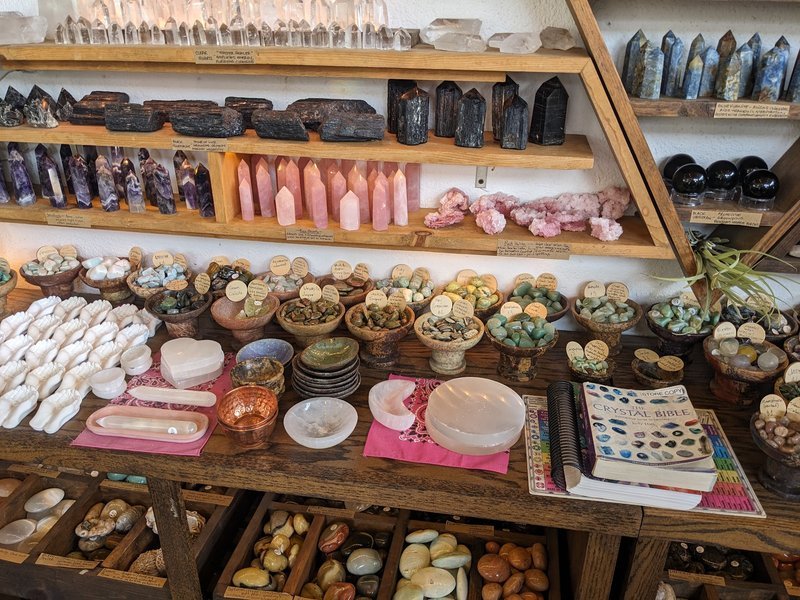 Organized crystal display with labeled stones and healing minerals