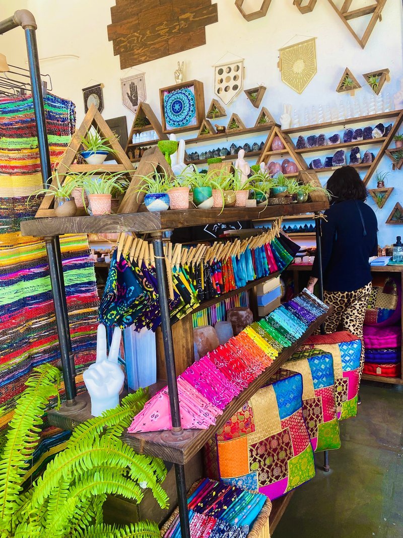 Display featuring crystal points, polished stones, and raw mineral specimens
