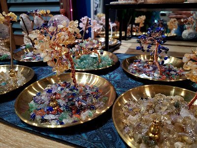 Organized crystal display with labeled stones and healing minerals