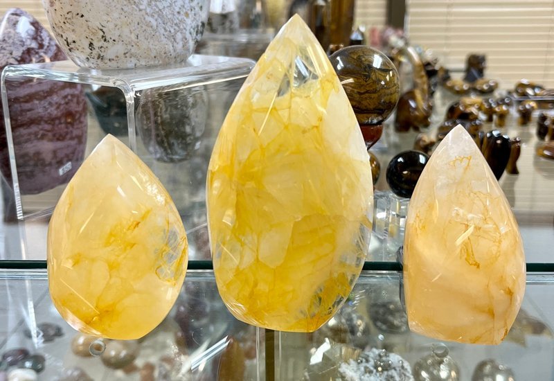 Collection of tumbled stones, raw minerals, and crystal clusters