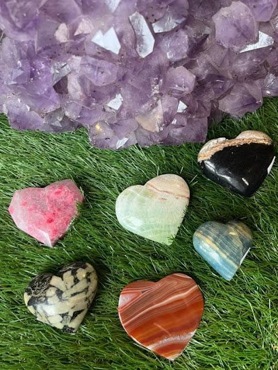Shelving display featuring amethyst, quartz, and various crystal specimens