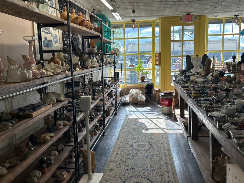 Collection of tumbled stones, raw minerals, and crystal clusters
