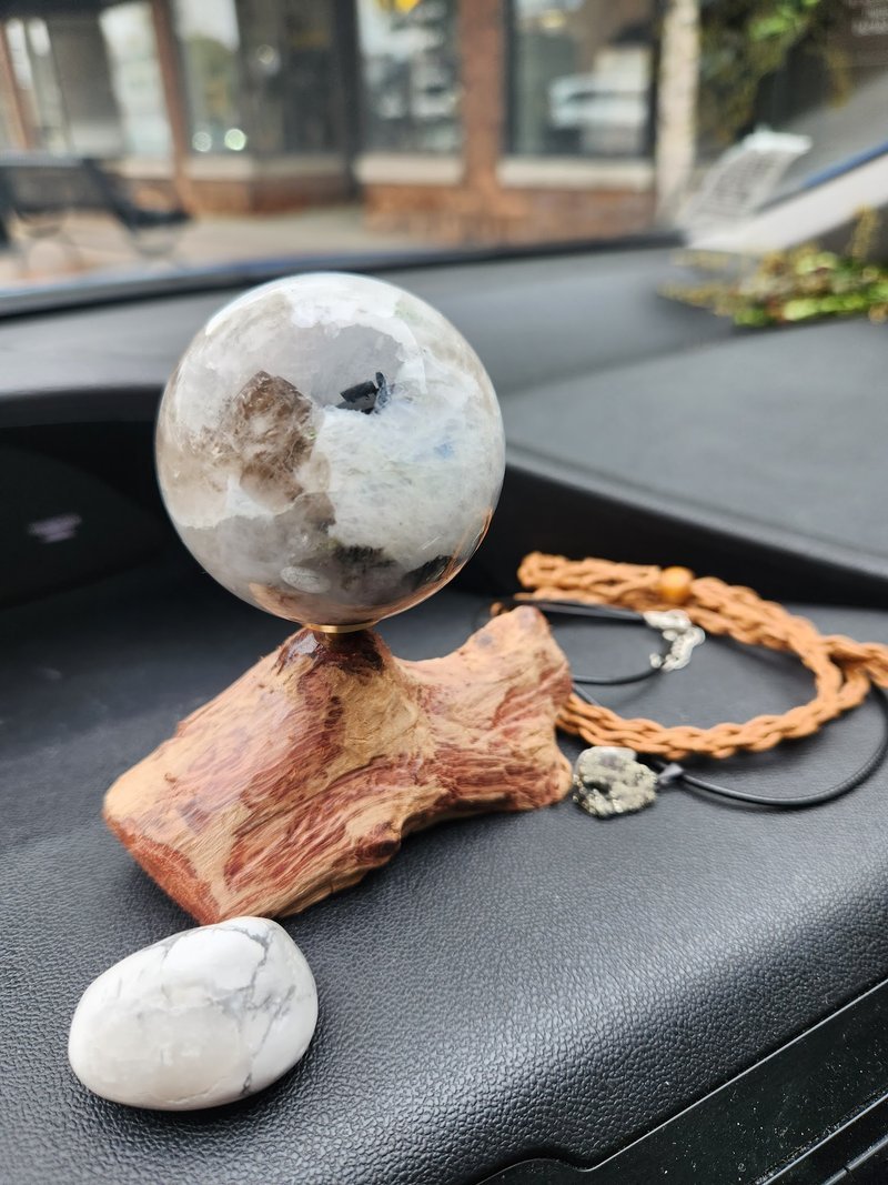 Retail shelving with organized crystals, stones, and spiritual products