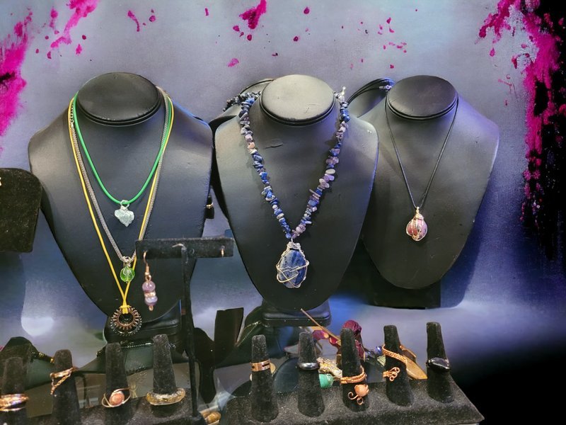 Collection of tumbled stones, raw minerals, and crystal clusters