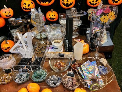 Shelving featuring chakra stones, healing crystals, and mineral specimens